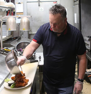 2-fat-guys preparing wings